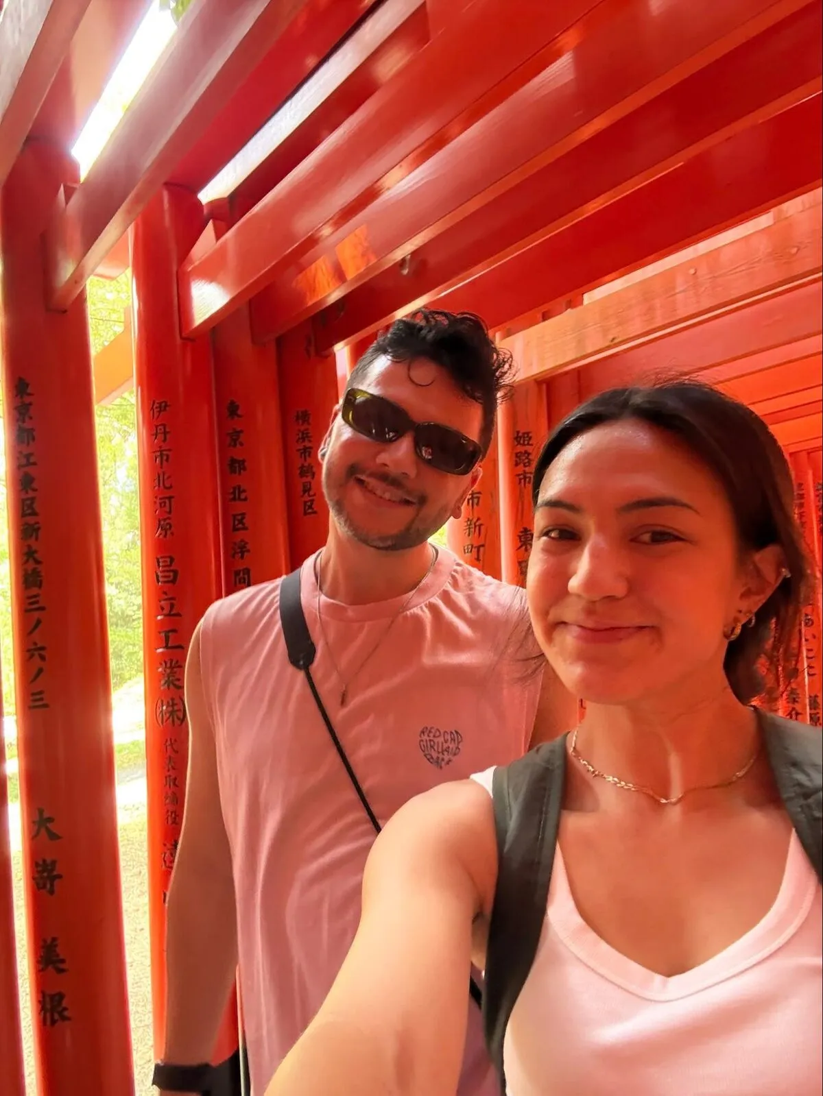 Brian and Nicole under red shrine gates in Japan
