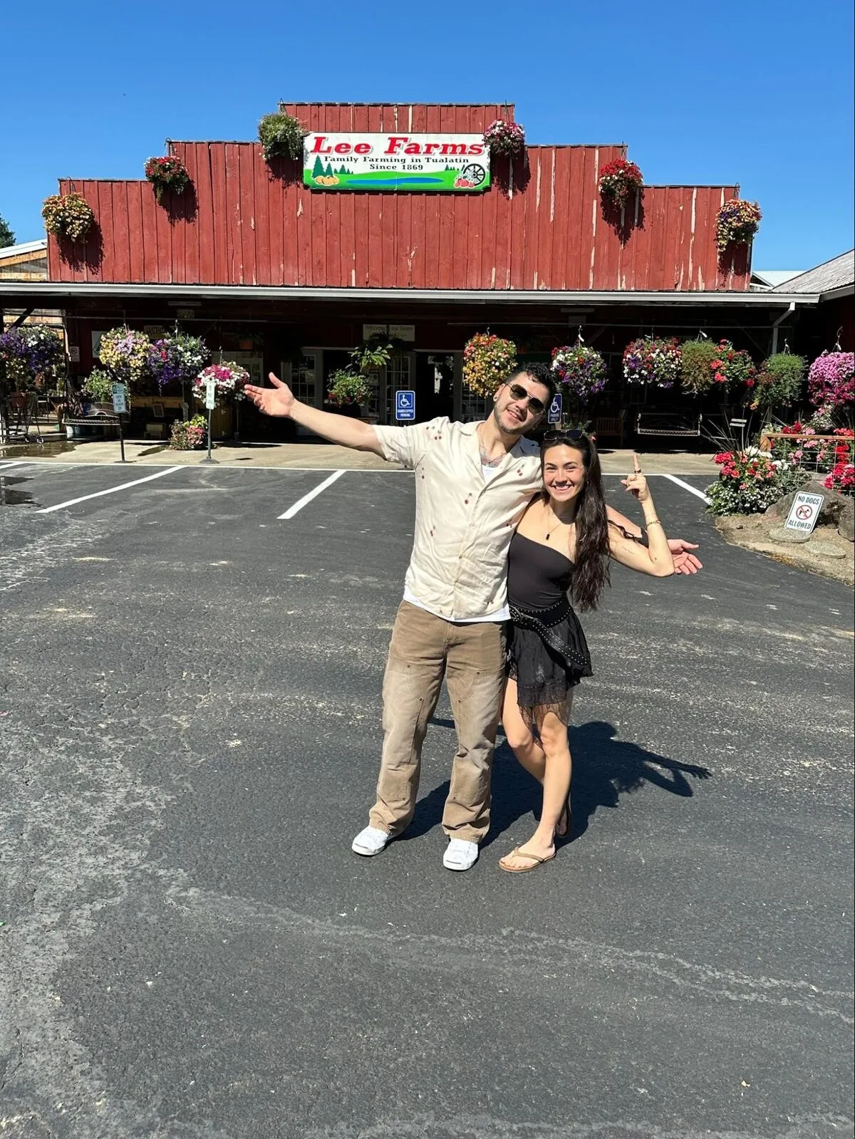 Brian and Nicole posing outside Lee Farms